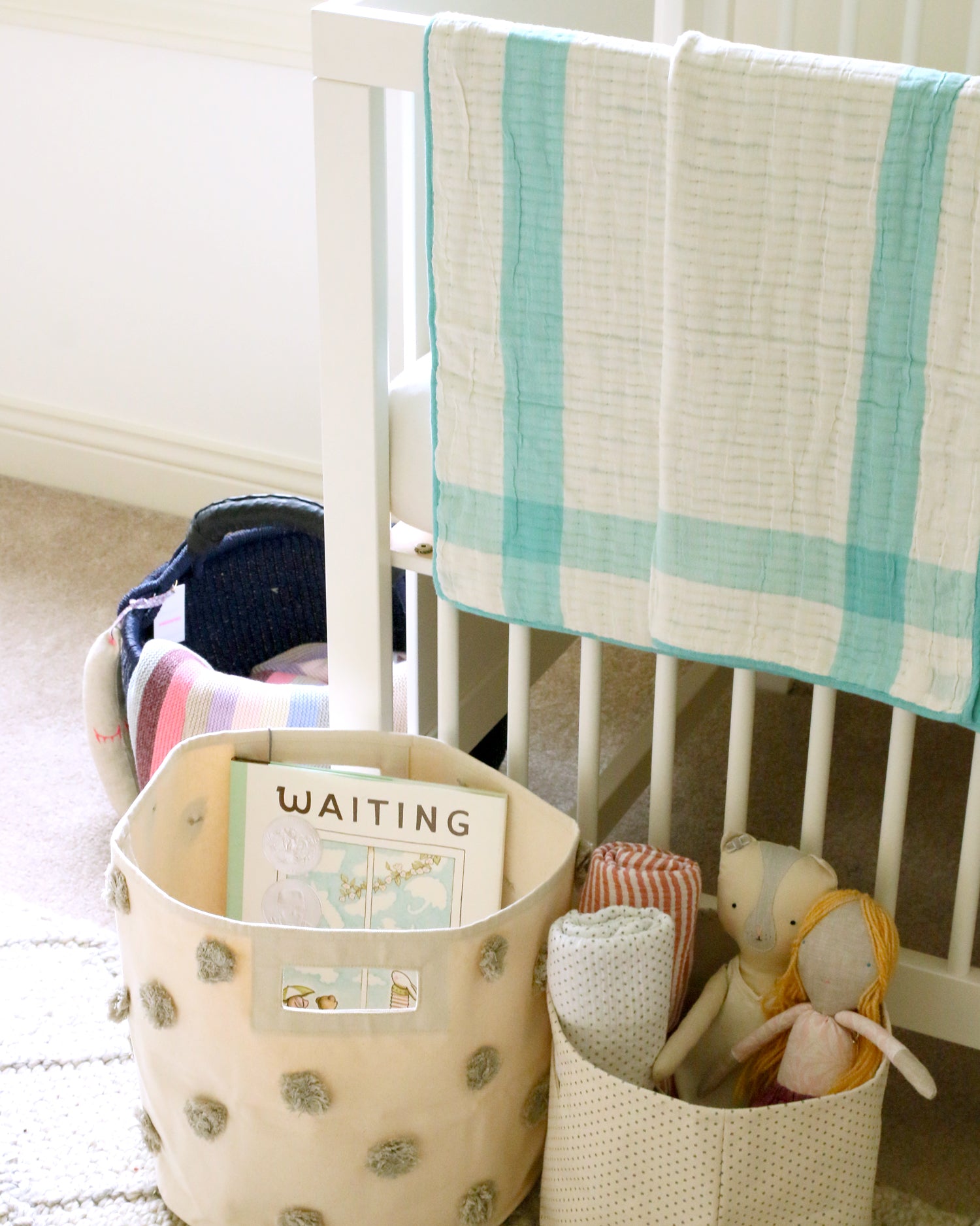cute girl's nursery baskets with books and soft toys