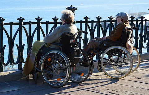 Old couple on their wheelchairs