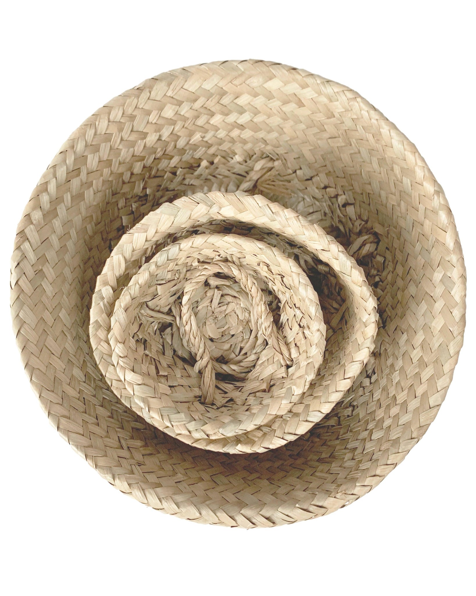 3 handwoven palm baskets stacked inside eachother
