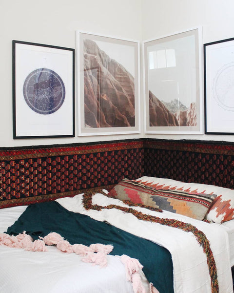 Liz Kamarul bedroom with vintage persian rug for the headboard