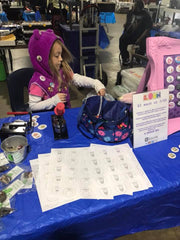 Arianna selling buttons