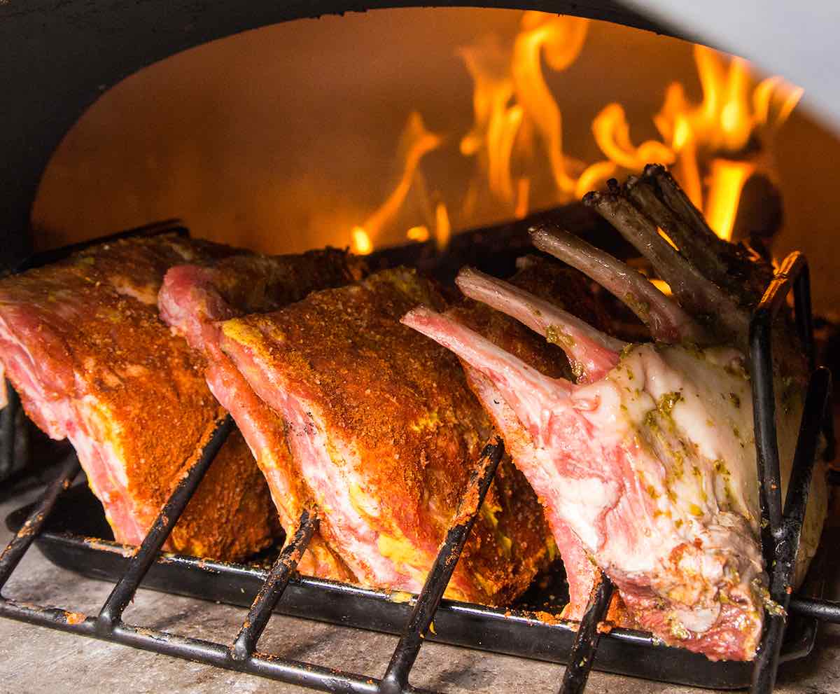 Cooking bbq ribs in a wood-fired oven