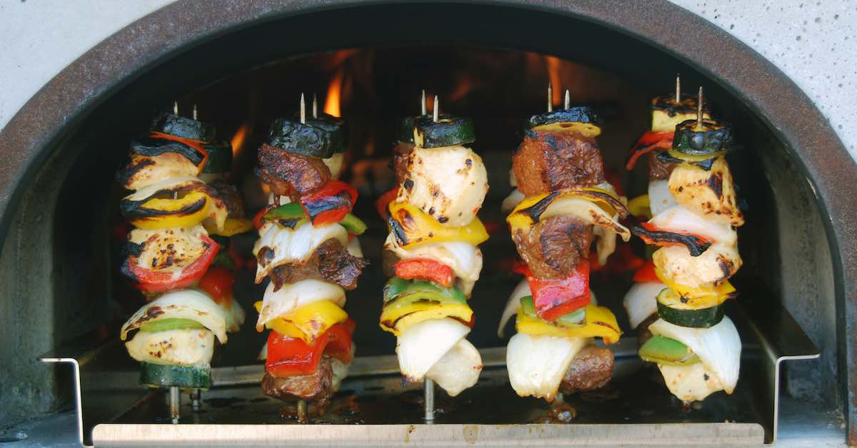 Cooking kabobs in a wood burning oven