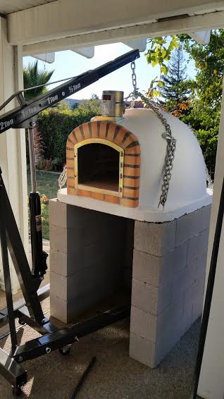 Brick pizza oven stand with engine hoist
