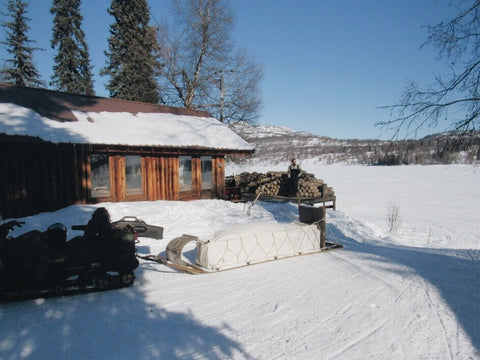 toboggan sled in front of roadhouse