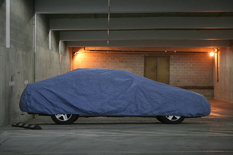 Preparing a Vehicle for Winter [Storage] image of covered car in storage unit