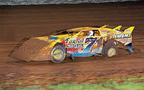 Dirt car with mud in grill