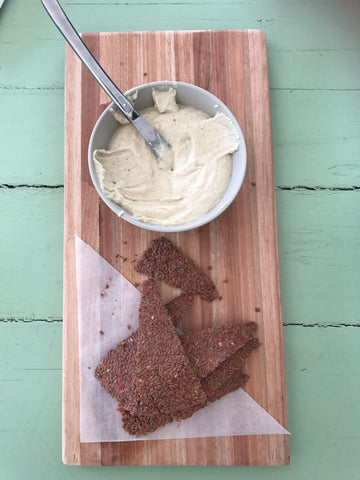 Unfermented cashew cream cheese and raw dehydrated flaxseed crackers