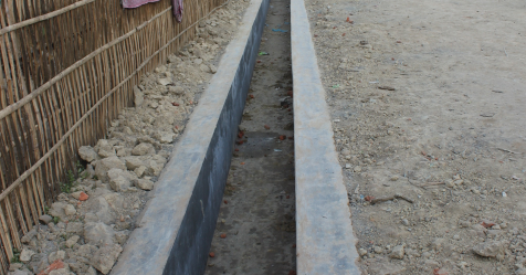 A new concrete drain at Borbeta Village in Chota Tingrai Tea Estate
