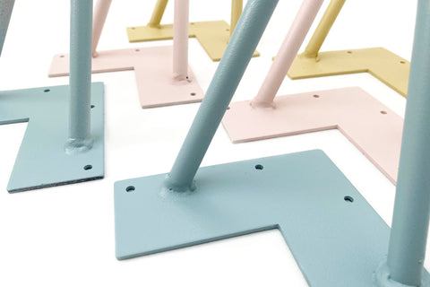 raw steel hairpin legs spray painted blue, pink, yellow