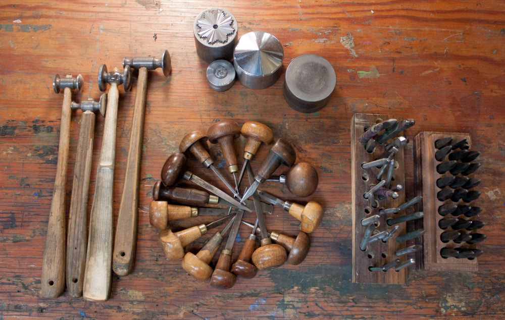 Metal engraving tools used to carve a die