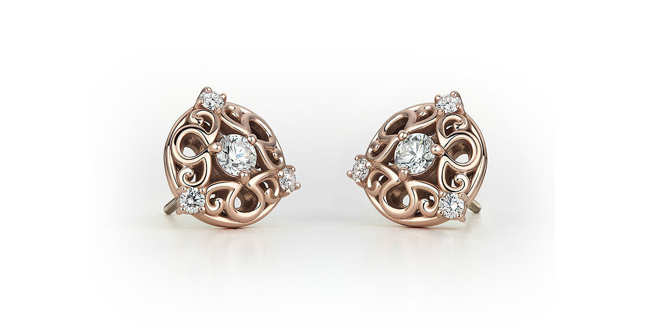 Rose gold and diamond bridal stud earrings, featuring an a/g initials symbol that creates a unique filigree pattern.