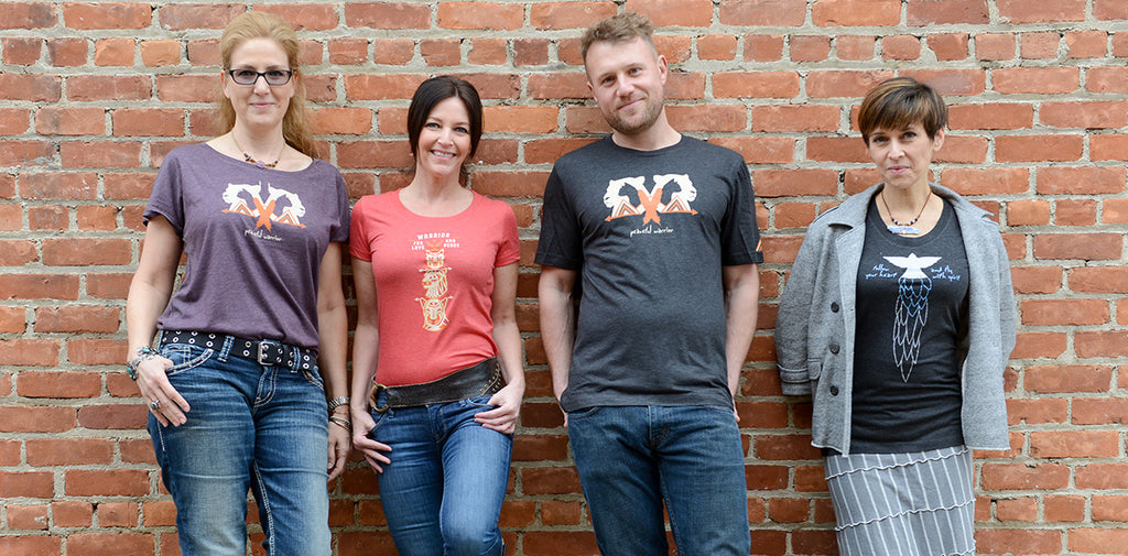 Group of models wearing Spirit Cat t-shirts