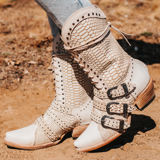 FREEBIRD women's Winnie white snake boot featuring a lace up shaft, leather accents, and a back brass zip closure
