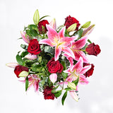 paradise pink lily red rose postabloom delivery