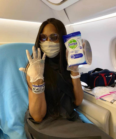 Naomi Campbell cleans plane tray table 