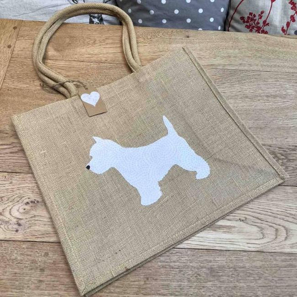 Brown jute bag with white fabric westie in the centre