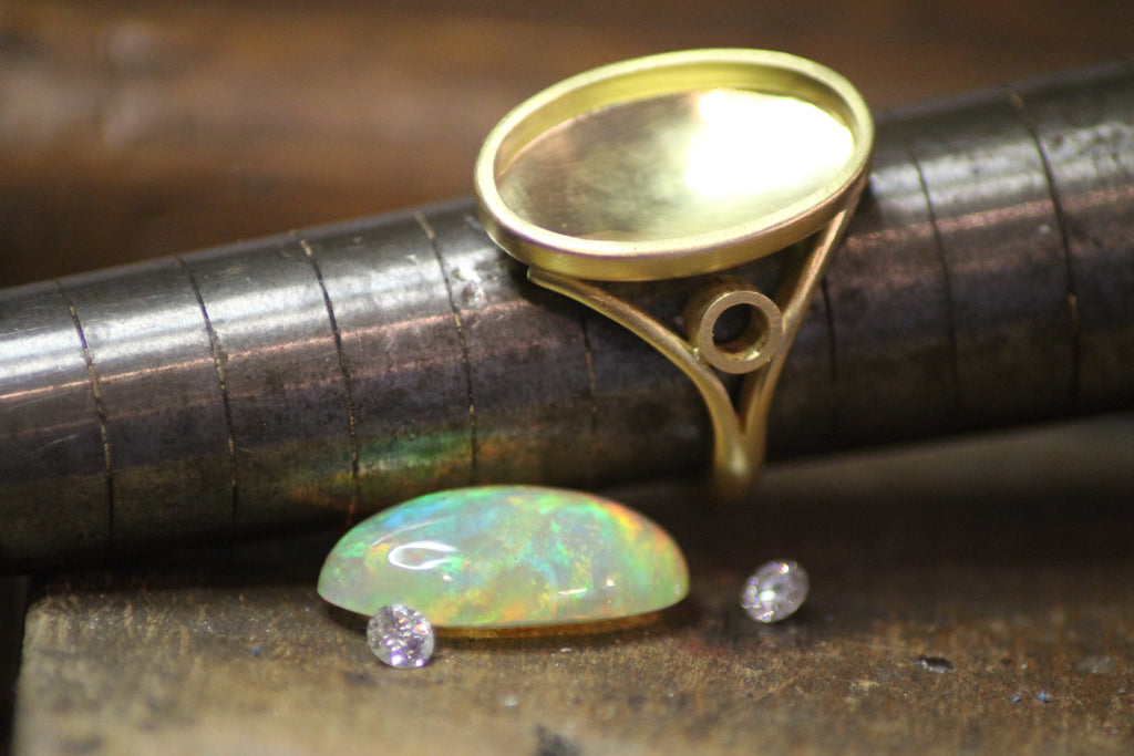 Rare Ethiopian opal ring with brilliant cut diamonds about to be set, design process photograph