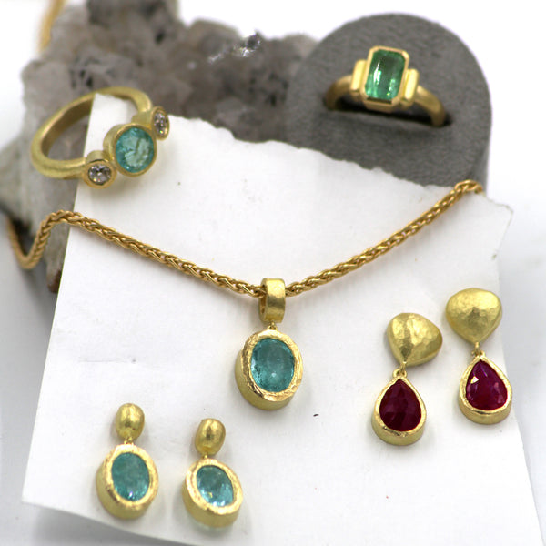 Selection of finish pieces featuring Paraiba tourmaline, ruby and diamonds