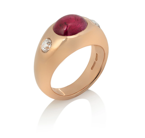 Large smooth yellow gold ring with gypsy set ruby cabochon, and two rose cut diamonds