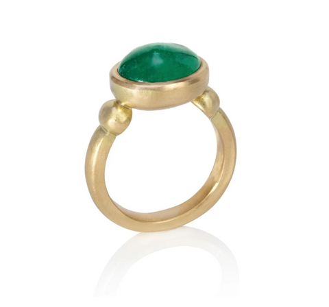 Yellow gold ring set with large oval emerald cabochon