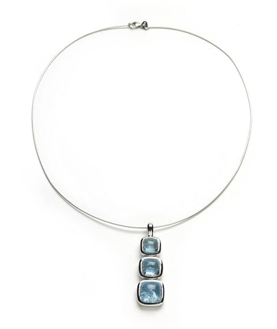 White gold necklace of aquamarine cabochons set in white gold on flexible torque