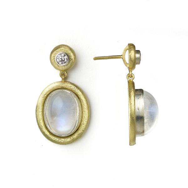 Moonstone cabochon earrings with diamonds, all set in white gold with textured yellow gold borders