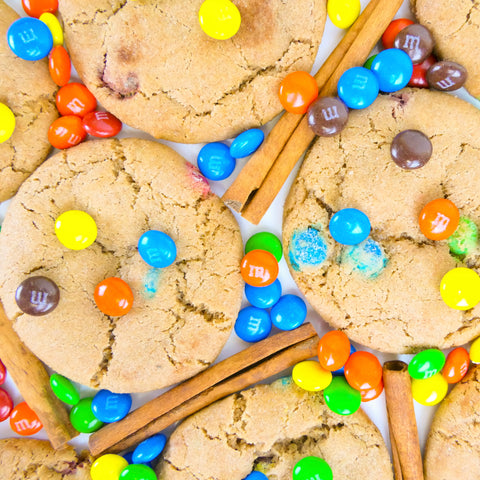 Cookies with m&m + cinnamon on table - Caramalized Snickerdoodle