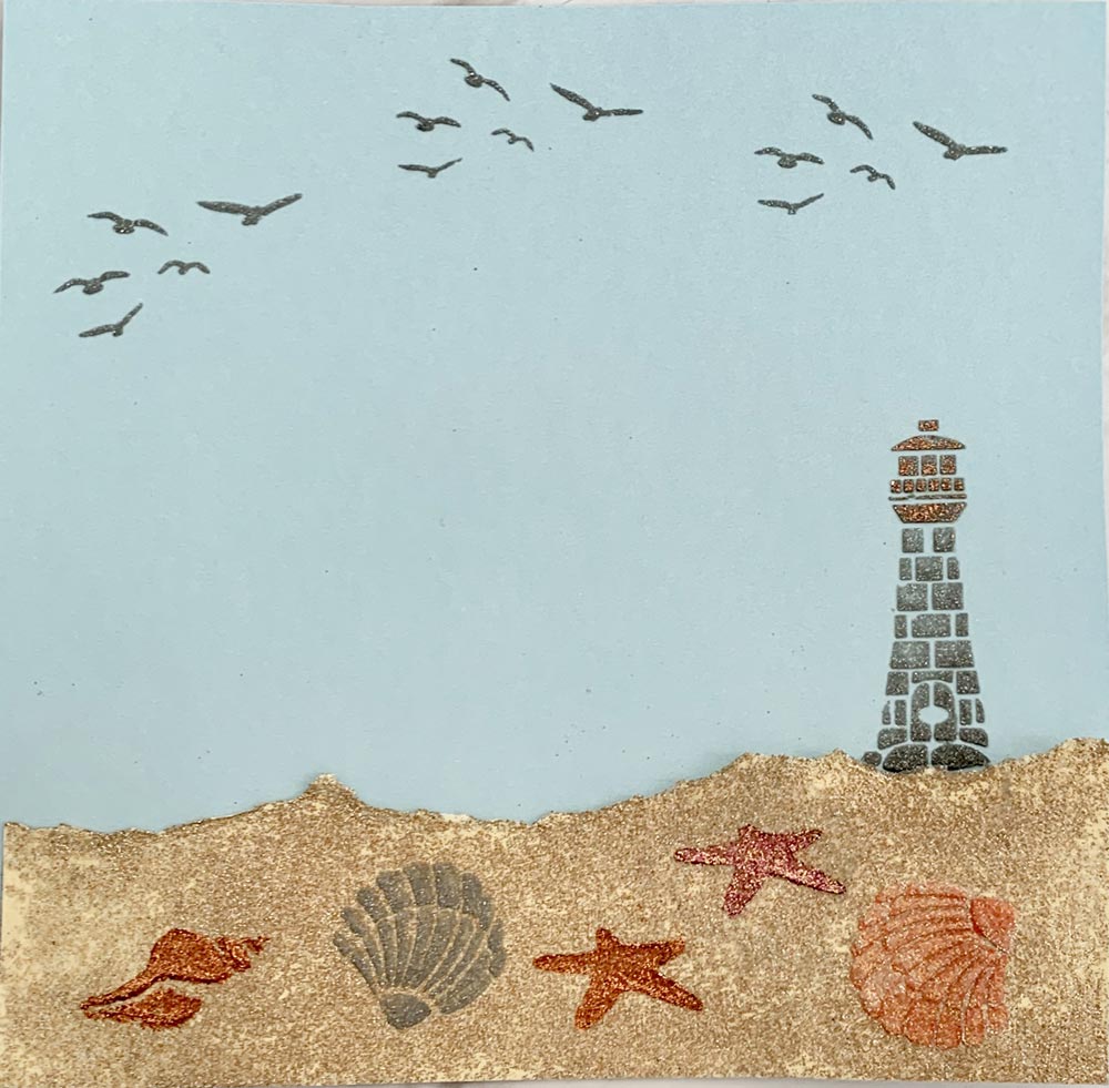 Seaside themed picture with seaside stencil, glittery sand and embellishments by Glitzcraft