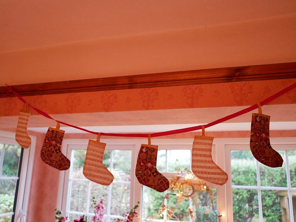 bunting style Christmas decoration with hanging stockings 