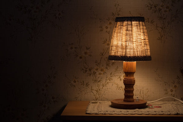 lamp on table in dark room 