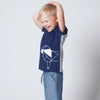 Made from premium 100% certified organic cotton. ReCreates' unisex short sleeve kids top is deep blue in the front with a charming geometric outline of a lion.
