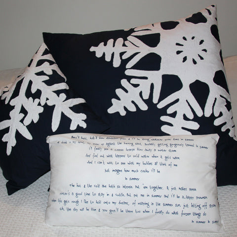 Handmade frozen themed cushions with snowflakes and lyrics