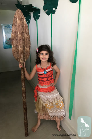 Girl in Moana costume with handmade oar