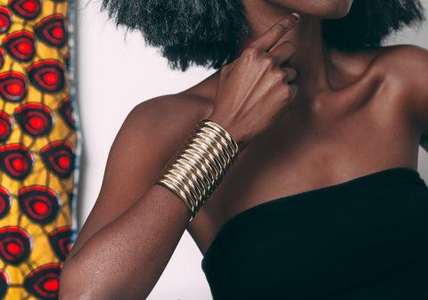 Close up of woman posing with Gold Ndebele Cuff