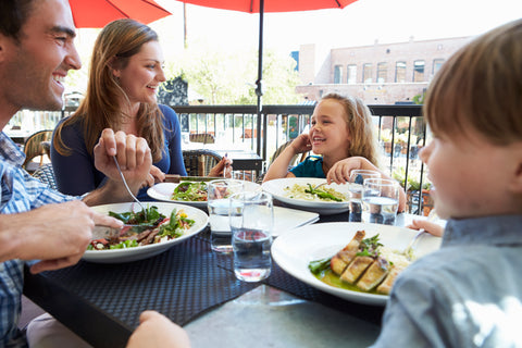 Family eating at an outdoor restaurant