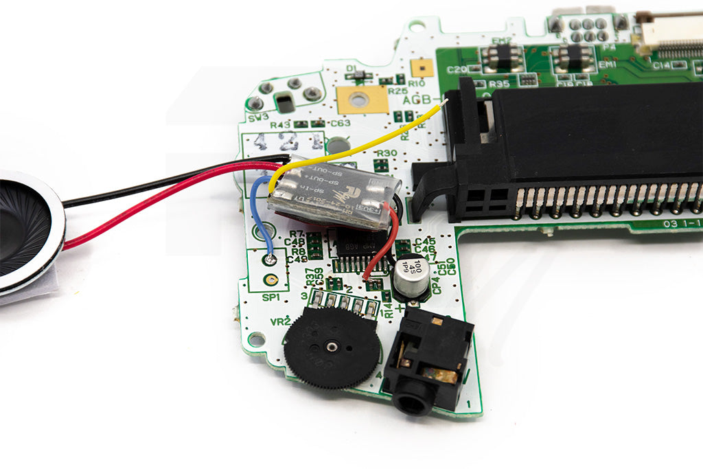 Solder the blue SP-In wire to the top solder point of SP1