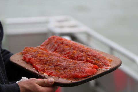 Fillet salmon on boat 