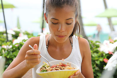asian girl eating salad