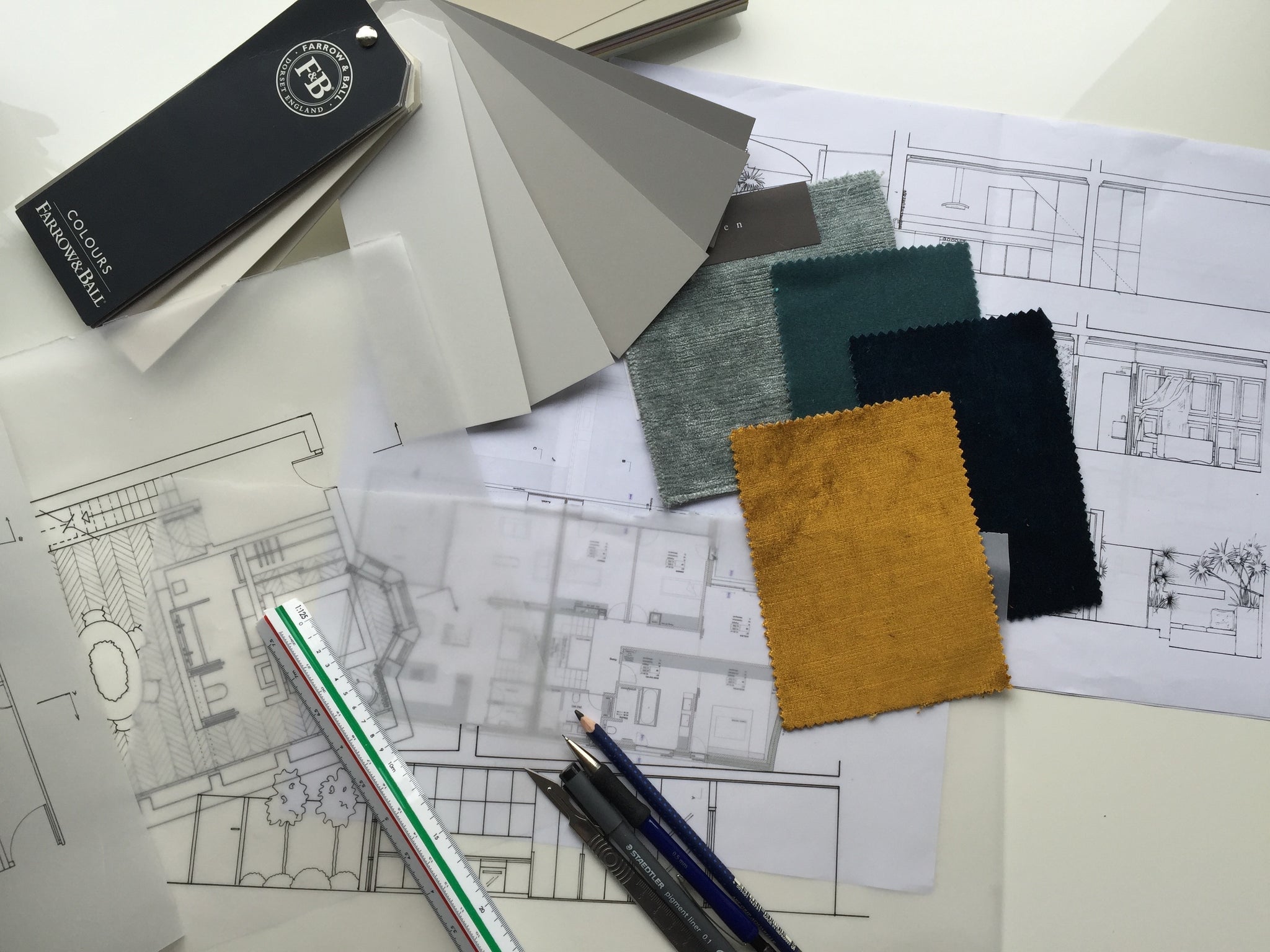 Working instruments of an interior designer, floor plans, fabric samples