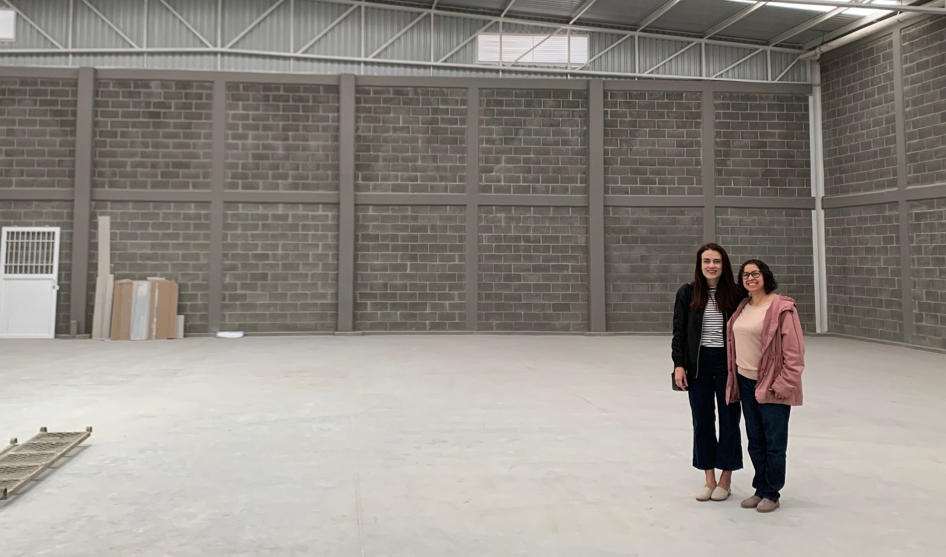 Justine and Lupita in her Leon factory