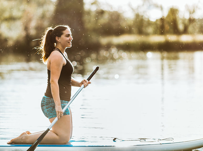 Austinite woman paddleboarding 