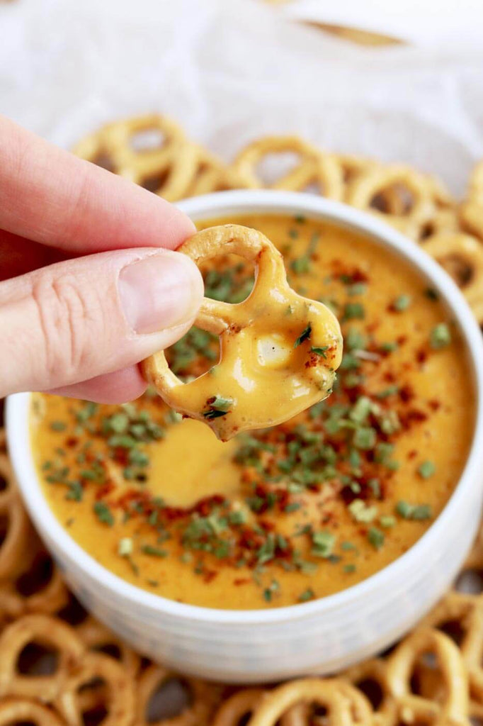 pretzel in queso dip
