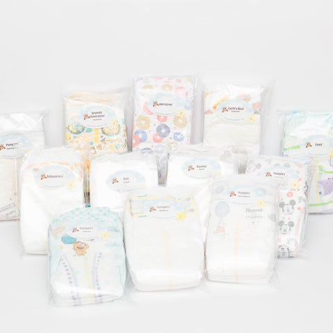 Photo of 12 brands of Diaper Samples including Huggies Little Snuggler, Huggies Snug & Dry, Pampers Swaddlers, Pampers Pure Protection, Pampers Baby Dry, Luvs, ABBY&FINN, Bambo Nature, Babyganics, ECO by Naty, Earth's Best and Seventh Generation