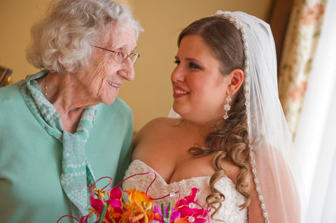 Young woman on her wedding day looking into the eyes of her grandmother