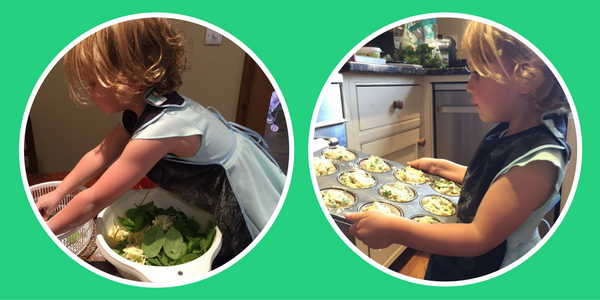 Toddler wearing the Apron making Cheese and Spinach muffin - baby-led weaning recipe