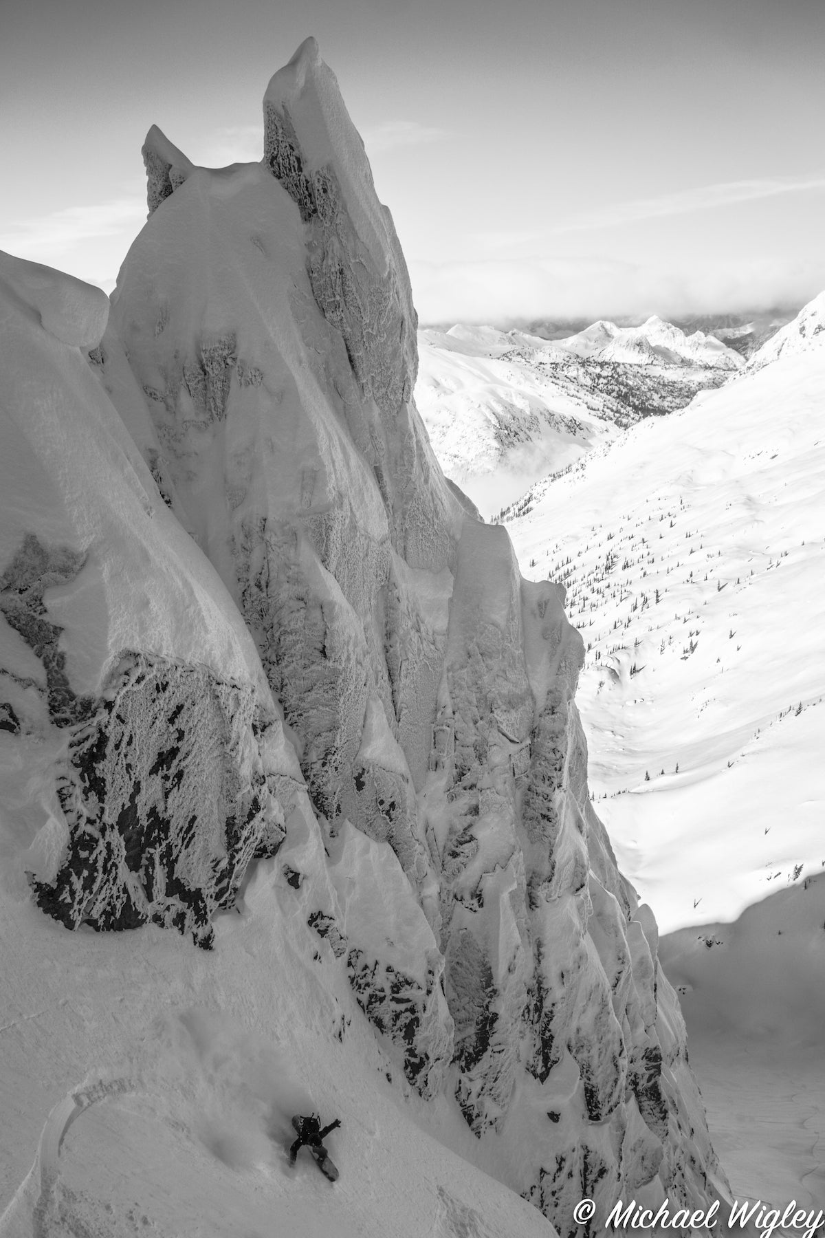 Jordan Osinchuk ripping the Cosmic Couloir under the devil horns. Venture Snowboards