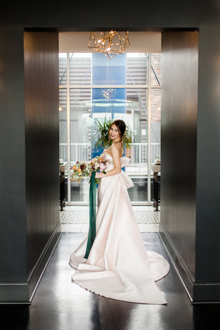 Bride at Juniper Rooftop in Columbus Green Silk Ribbon by The Lesser Bear Photo by Jenny Haas Florals State and Arrow Styling and Planning Auburn and Ivory Creative