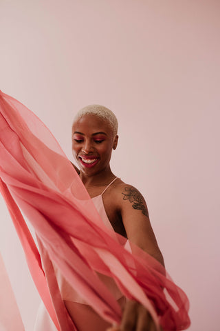 model dancing with pink silk ribbon by The Lesser Bear