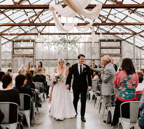 Couple walking down the aisle as new Mr. and Mrs. Silk Ribbon by The Lesser Bear